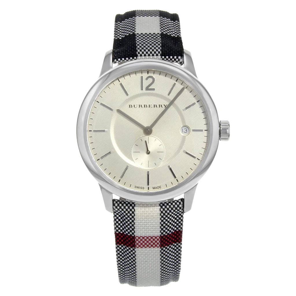 An image of a Wristwatch by Burberry. This Pre Owned item is designed for Unisex, featuring a Casual style. It has a Quartz movement and an Analog display with a Silver dial color. The indices include 12-Hour Dial,Stick Indexes. The band is made of Leather and the case is made of Stainless Steel. The watch has a Round shape with a case size of 40 mm and a case thickness of 8 mm.