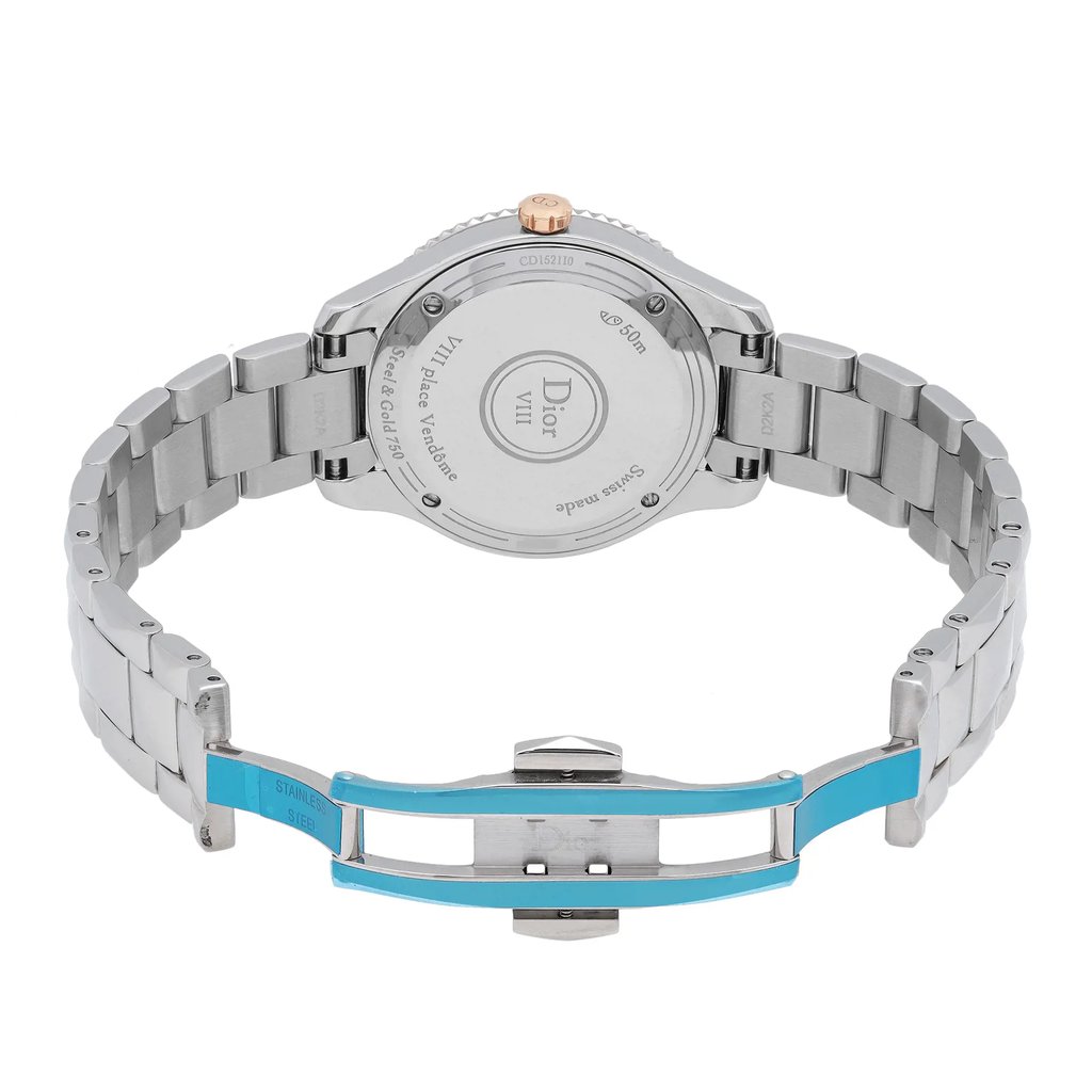 An image of a Wristwatch by Dior. This Pre Owned item is designed for Women, featuring a Casual style. It has a Quartz movement and an Analog display with a White dial color. The indices include 12-Hour Dial,Arrow Markers. The band is made of Stainless Steel and the case is made of Stainless Steel. The watch has a Round shape with a case size of 32 mm and a case thickness of 9 mm.
