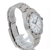 An image of a pre-owned men's Rolex wristwatch positioned at a slight angle, showcasing the right side and face of the watch. The watch features a white dial with a date indicator and luminous hands. The stainless steel bracelet and bezel are clearly visible, with the watch resting on a transparent stand. The image is taken from a medium distance, highlighting the watch's design and details.
