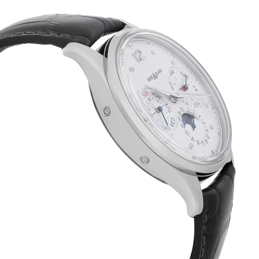 An image of a pre-owned Montblanc luxury men's wristwatch, displayed in a side profile view opposite the crown, emphasizing the watch's round shape and stainless steel case. The watch features a white dial with gray bezel, luminous hands, and complications such as day/date, GMT, and moon phase. It is attached to a black leather band. The photo is taken at a close distance, showcasing the timepiece at an angle that reveals slight imperfections on the hands and dial.