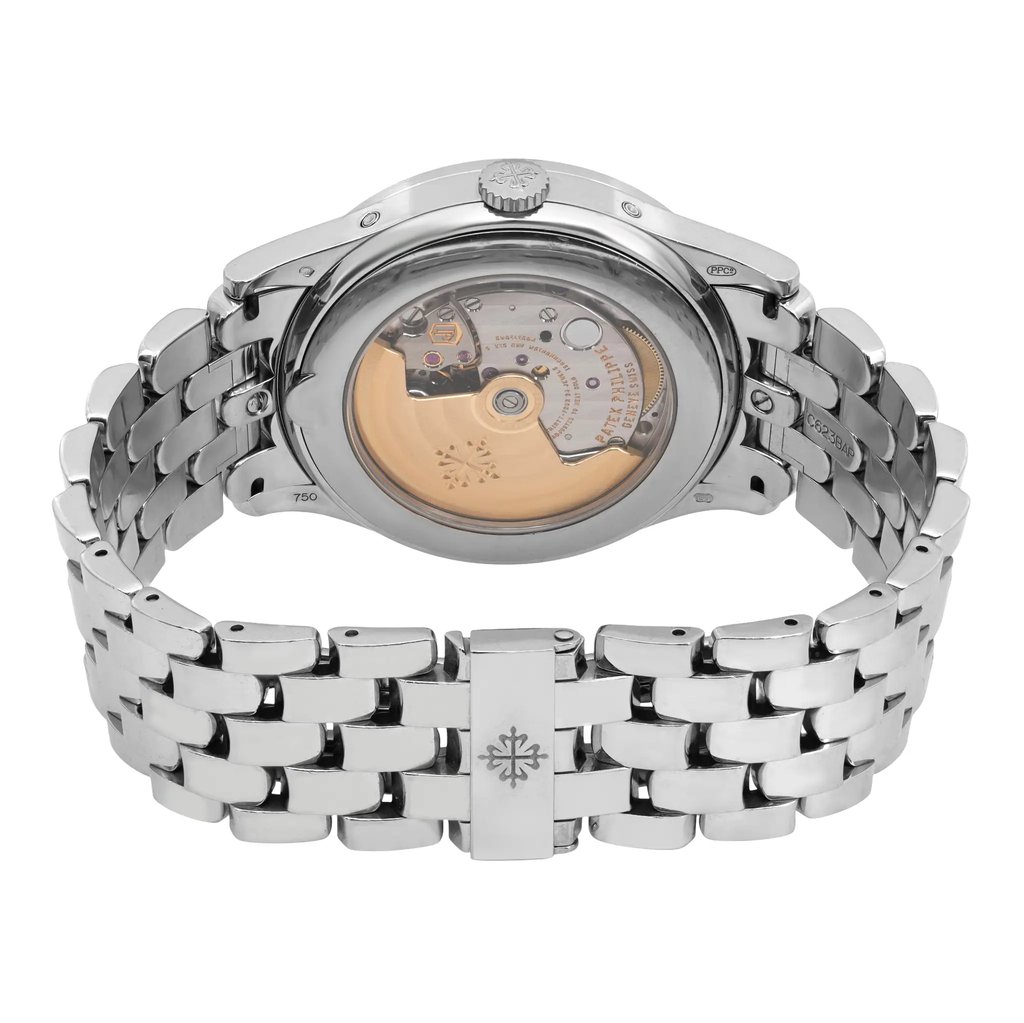 An image of a pre-owned Patek Philippe men's wristwatch, featuring a white gold bracelet and a visible case back showing the intricate movement. The watch is positioned upright, with the back facing the viewer, showcasing the detailed mechanics. The angle captures the watch from a slightly elevated perspective, emphasizing the craftsmanship of the movement. The distance provides a clear and detailed view of the watch's back, highlighting its features such as the date indicator and moon phase.