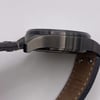 View of opposite crown facing side of the stainless steel case with a dents and scratches on it