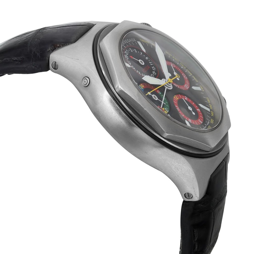 An image of a pre-owned wristwatch shown from a side profile view, opposite the crown. The angle highlights the sleek contours of the metal case and the multi-colored dials on the watch face. The black leather strap is partially visible, and the photo is taken up close, emphasizing the watch's detailed craftsmanship.