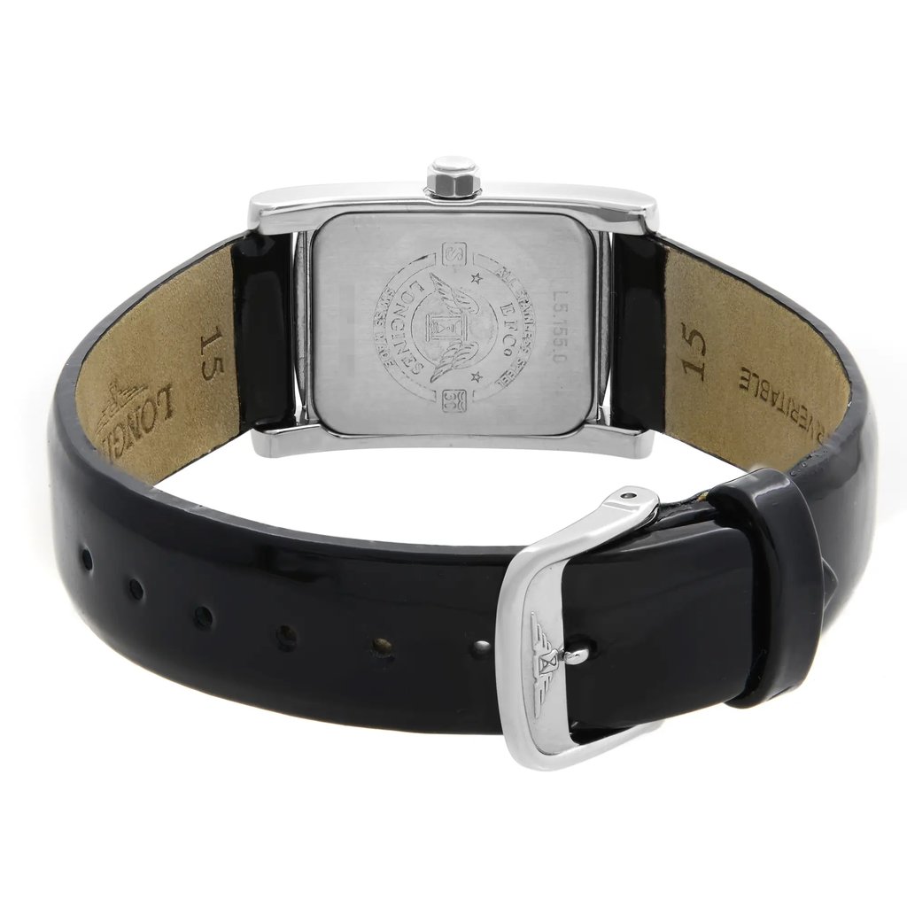 An image of a wristwatch showcasing the back view, featuring a close-up of the clasp. The watch has a rectangular case with engraved details, and a black leather strap partially visible. The image highlights the display model's polished metal and craftsmanship, with the clasp prominently in the forefront. The angle is slightly elevated, providing a clear view of the watch's back and clasp from a short distance.