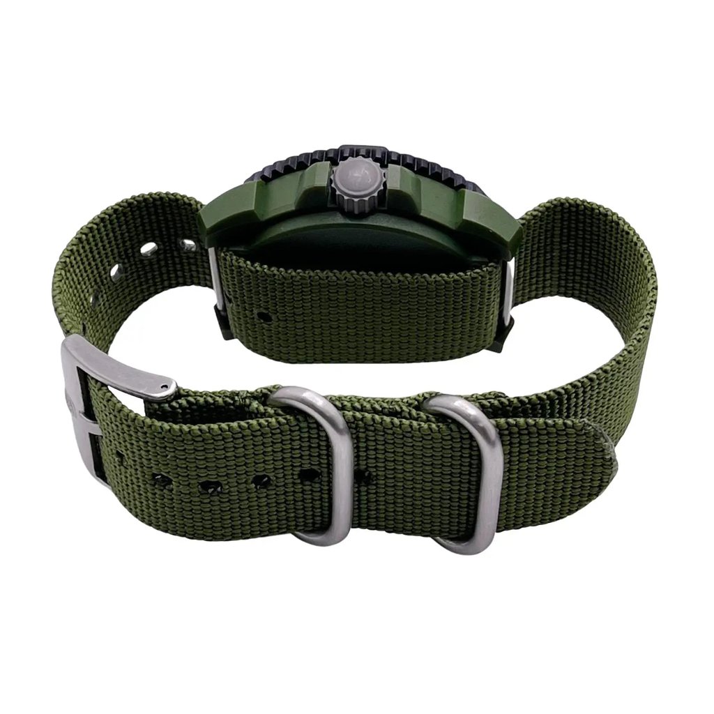An image of a Wristwatch by Luminox. This Pre Owned item is designed for Men, featuring a Casual,Diver style. It has a Quartz movement and an Analog display with a Black dial color. The indices include 12-Hour Dial,Arabic Numerals,Easy to Read/Large Numerals. The band is made of Nylon and the case is made of Carbon. The watch has a Round shape with a case size of 44 mm and a case thickness of 14 mm.