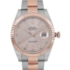 An image of a Rolex Oyster Perpetual Datejust wristwatch for men in excellent condition. The photo is a close-up frontal view of the watch face, showcasing a sundust-colored dial with rose gold bezel and stick indexes indicating the hours. Luminous hands are visible, and a date indicator sits at the 3 o'clock position. The round case is made of stainless steel, attached to a two-tone band combining rose gold and stainless steel. The watch is positioned straight on, with the camera angle perpendicular to the face of the watch, providing a clear view of its luxury style and features.
