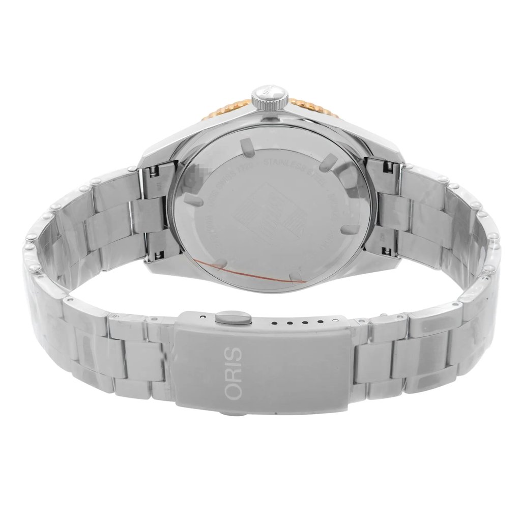 An image of a wristwatch shown from the back view, highlighting the closed clasp. The watch is positioned upright with the clasp facing the viewer, capturing the stainless steel bracelet in a slightly curved angle. The focus is close, emphasizing the clasp and the back of the watch, which features a brushed metal finish. The watch is a display model and is in good condition.