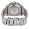 An image of a pre-owned Cartier men's wristwatch, viewed from the back. The watch is positioned upright, showcasing the intricate mechanical movement through a transparent case back. The angle captures the full bracelet and the crown adorned with a blue cabochon. The watch features a combination of steel and rose gold links, emphasizing its luxurious design. The image is taken at a close distance, highlighting the craftsmanship and detail of the watch's components.