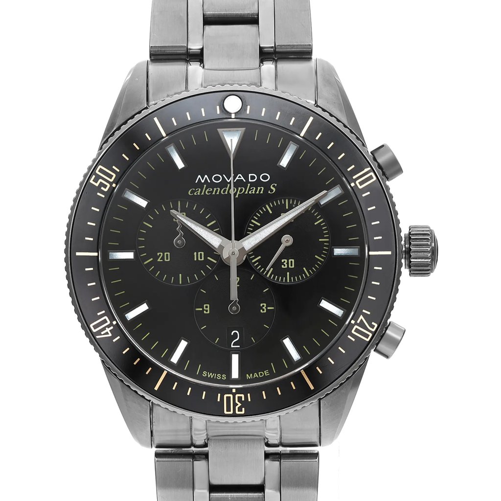 An image of a pre-owned wristwatch taken from a front close-up angle, focusing on the watch face. The watch features a stainless steel band, a black dial with luminescent hands, and three subdials. The brand name and additional text are visible on the dial, with markings around the bezel for added detail.