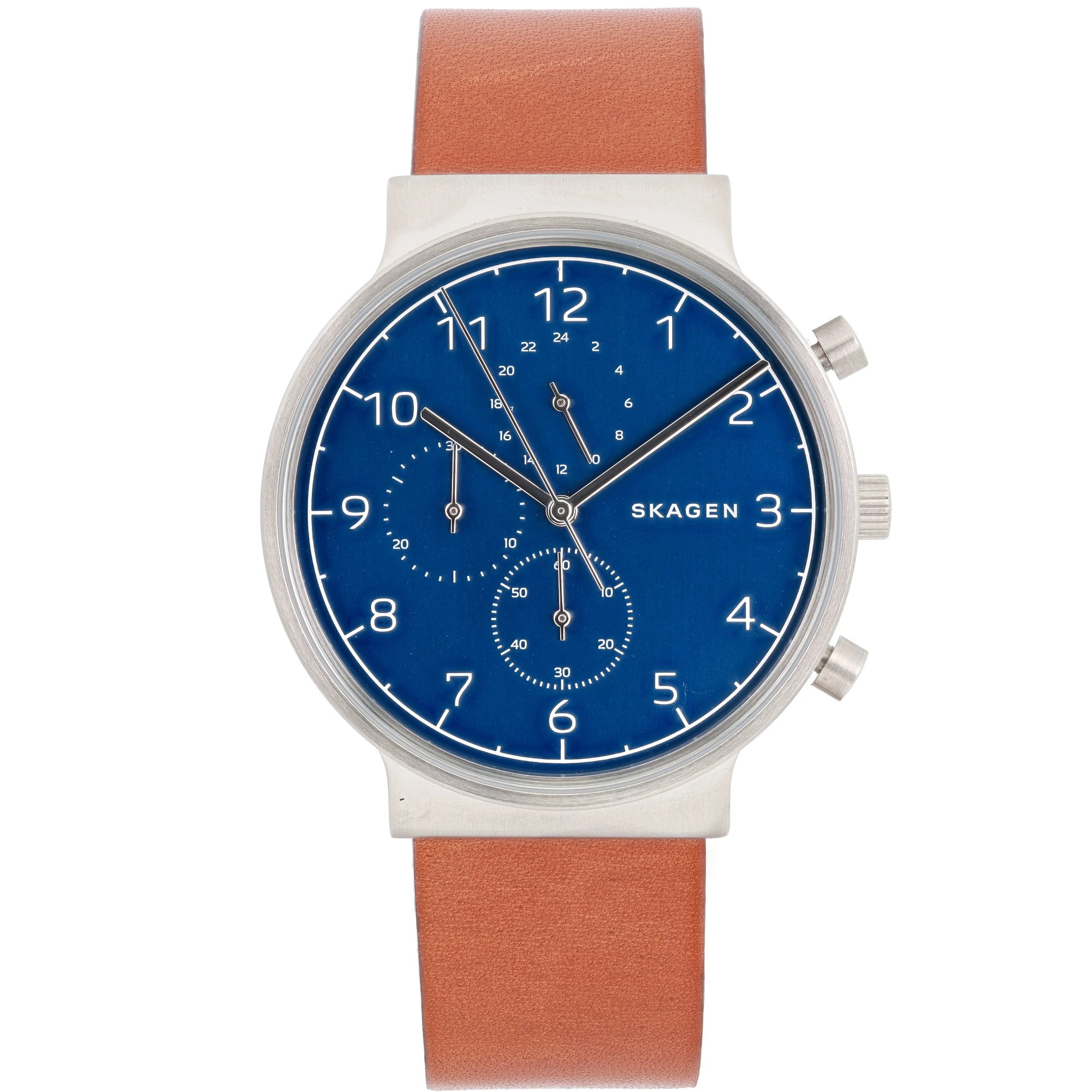 An image of a Skagen men's wristwatch, displayed as a model. The watch is positioned upright and viewed from the front at a close distance. It features a blue dial with white numerals and a chronograph function, alongside a date indicator. The case is silver-toned with side buttons, and it has a brown leather strap.