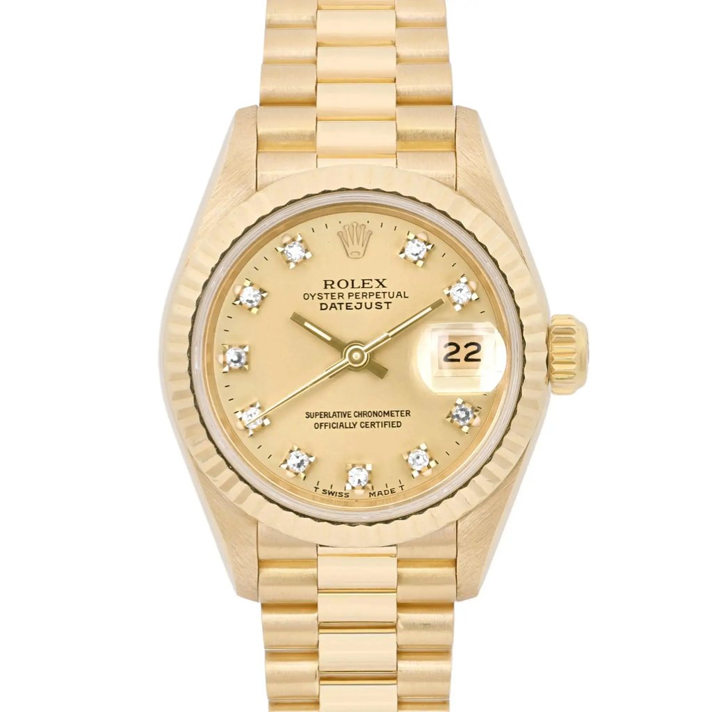An image of a pre-owned women's Rolex wristwatch, viewed from a straight-on angle at a close distance. The watch features a yellow gold design with a date indicator and luminous hands. The face is adorned with diamond hour markers, and the brand's logo is visible near the top. The watch is positioned centrally in the image, showcasing its detailed craftsmanship.