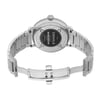 An image of a wristwatch viewed from the back, displaying an open clasp. The watch is a display model with a metallic band, showcasing detailed engravings on the case back. Positioned at a slight upward angle, the watch is captured from a medium distance, highlighting the craftsmanship and design elements.