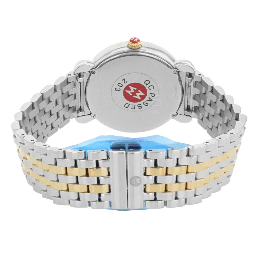 An image of a pre-owned wristwatch taken from a back view angle, showcasing the closed clasp. The watch features a two-tone metal bracelet with alternating silver and gold links. The clasp is centered in the foreground, with the watch case and "QC PASSED" sticker visible in the background. The watch is positioned at a close distance, highlighting the details of the bracelet and the back of the watch case.