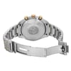 An image of a pre-owned men's OMEGA wristwatch viewed from the back with an open clasp. The round stainless steel case features a screwback design, and the band is also made of stainless steel. The single fold-over clasp with a push button is open, revealing the inner side. The watch is positioned centrally, captured at a close distance and straight angle, highlighting its features and good condition.