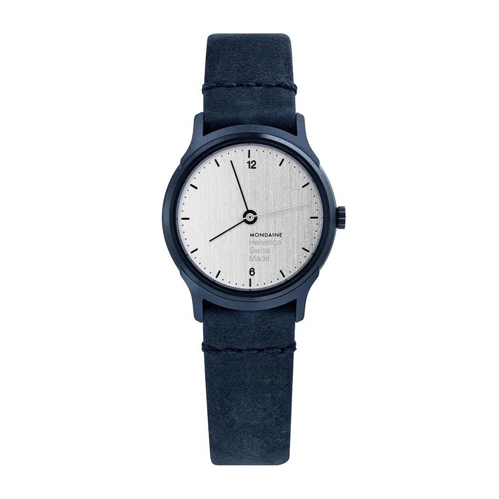 An image of a Wristwatch by Mondaine. This Pre Owned item is designed for Women, featuring a Casual style. It has a Quartz movement and an Analog display with a Silver dial color. The indices include 12-Hour Dial,Arabic Numerals,Stick Indexes. The band is made of Leather and the case is made of Stainless Steel. The watch has a Round shape with a case size of 26 mm and a case thickness of 6 mm.