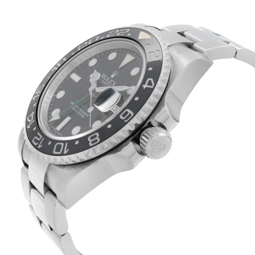 An image of a pre-owned men's luxury Rolex wristwatch, shown from a side profile view. The crown is prominently visible, situated on the right side of the stainless steel case. The round watch has a black dial and bezel, complemented by a stainless steel band. Features include a date indicator, luminous hands, and GMT functionality. The watch is angled slightly upward, highlighting its design, and is captured from a close distance.