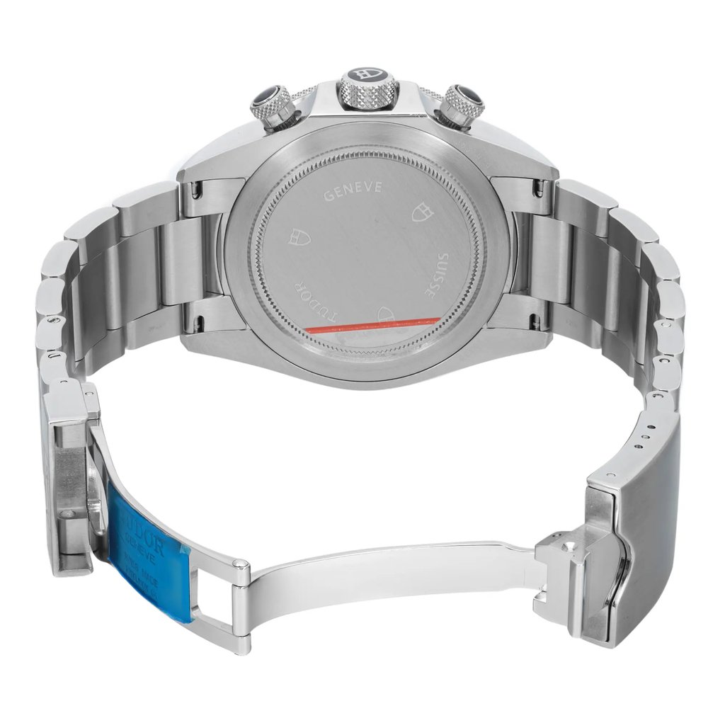 An image of a wristwatch taken from the back view, showcasing the open clasp. The watch is positioned horizontally, revealing the stainless steel bracelet and the back of the case. The image is taken at a close angle, highlighting the details of the clasp mechanism and the engraved markings on the case back. The watch is a display model, emphasizing its pristine condition.