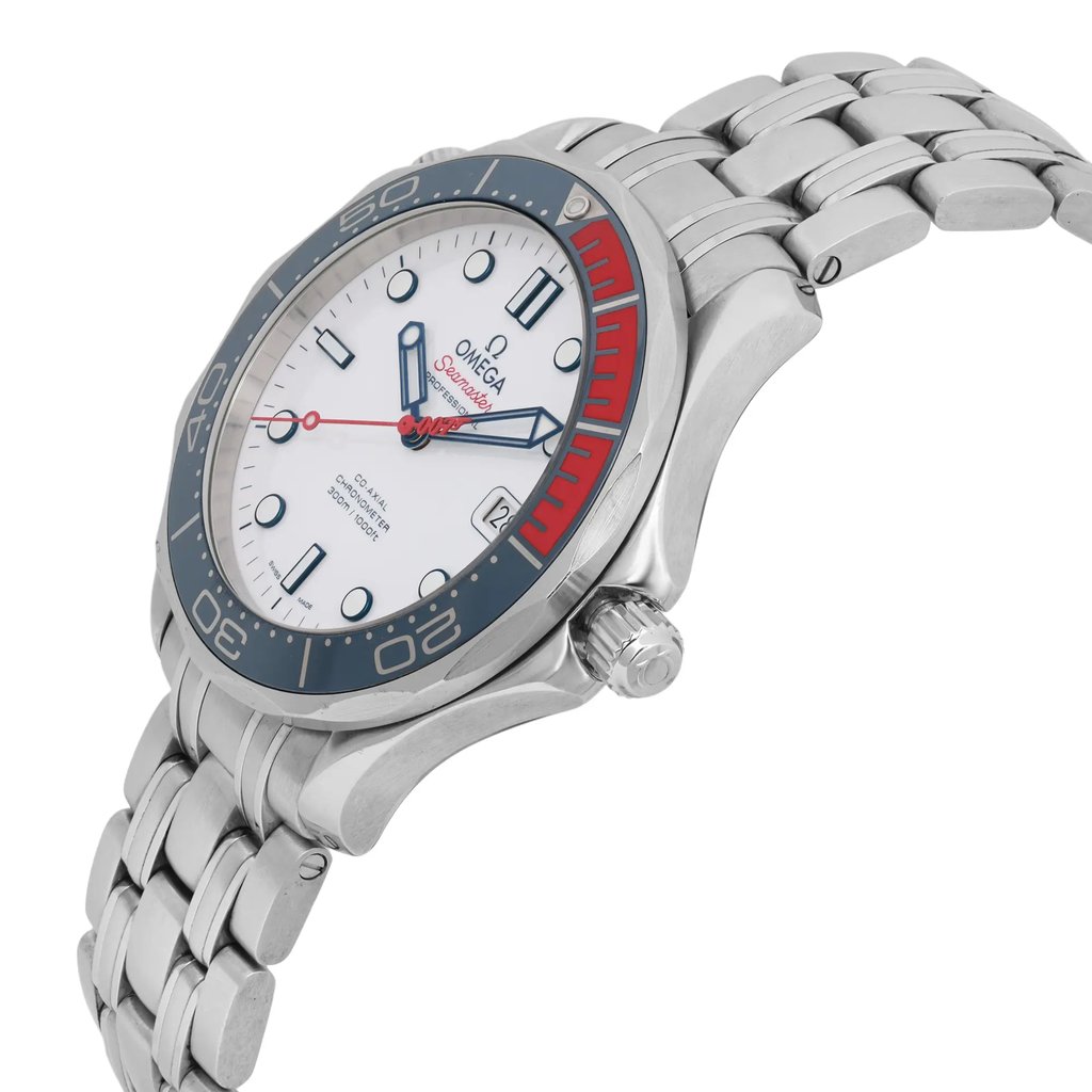 An image of a pre-owned men's OMEGA wristwatch taken from a slightly elevated angle, showcasing the side and face of the watch. The watch features a stainless steel bracelet and a white dial with a navy blue and red bezel. Luminous hands and a date indicator are visible on the watch face. The image is captured at a close distance, highlighting the details and craftsmanship.