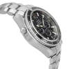An image of a pre-owned men's OMEGA wristwatch taken from a side angle, showcasing the stainless steel case and bracelet. The watch features a black dial with chronograph sub-dials, a date indicator, and luminous hands. The bezel has engraved numbers, and the crown is visible on the left side. The image is taken at a close distance, highlighting the details of the watch's design and features.