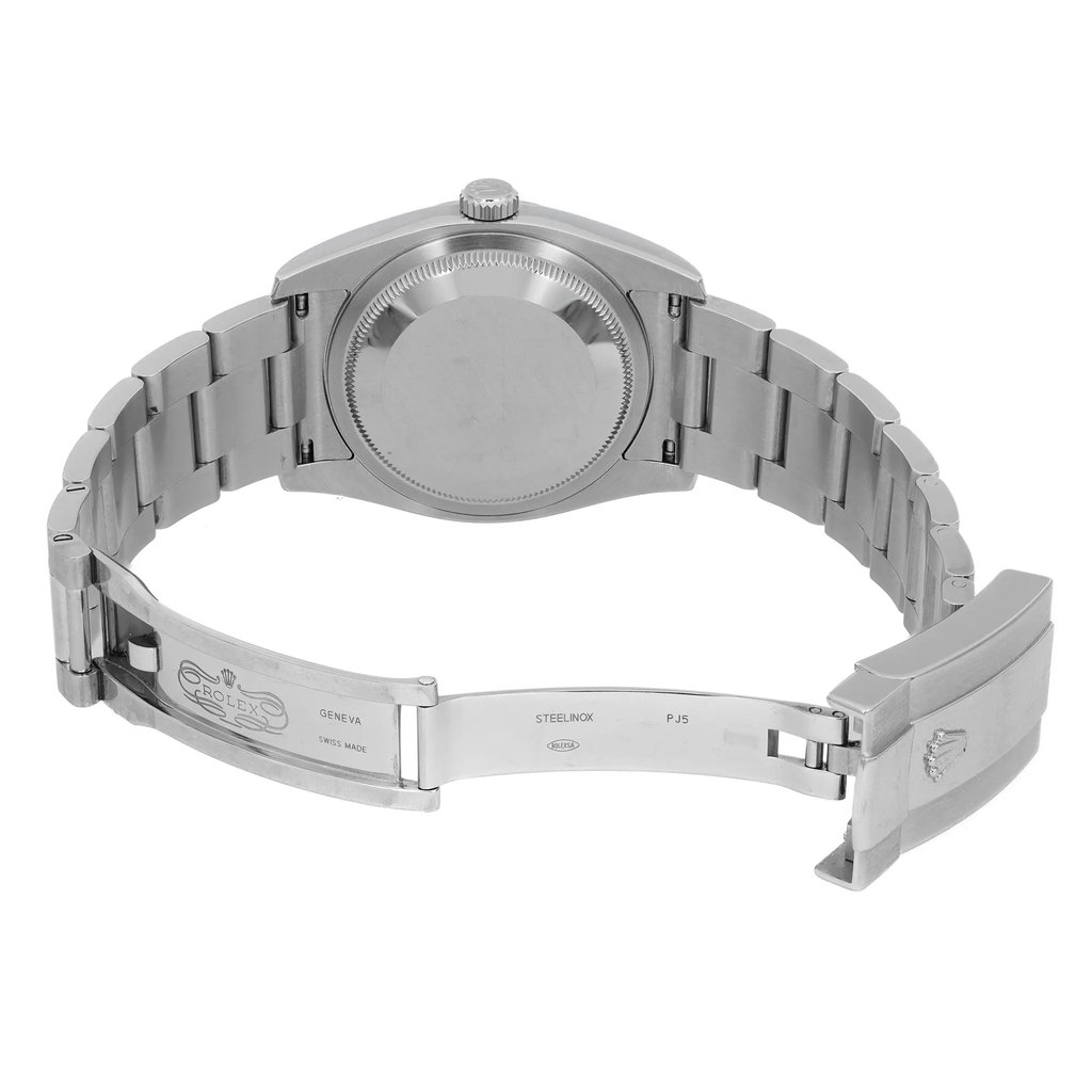 An image of a pre-owned wristwatch shown from the back view, positioned at eye level with the clasp open. The angle highlights the stainless steel links and the inner clasp, revealing engraved details. The watch is centered in the frame, captured from a moderate distance to showcase the full bracelet and case back.