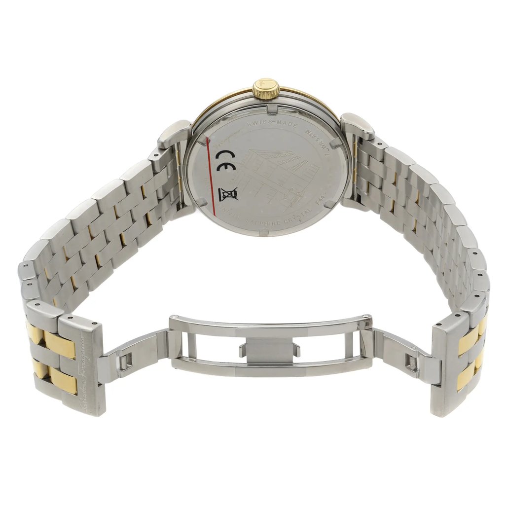 An image of a Wristwatch by Salvatore Ferragamo. This Unworn item is designed for Unisex Adult, featuring a Dress/Formal style. It has a Quartz movement and an Analog display with a Silver dial color. The indices include 12-Hour Dial,Non-Numeric Hour Marks,Stick Indexes. The band is made of Stainless Steel and the case is made of Stainless Steel. The watch has a Round shape with a case size of 40 mm and a case thickness of 9 mm.