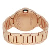 An image of a pre-owned wristwatch shown from the back view with an open clasp. The watch is positioned centrally, with the camera capturing it at a slightly elevated angle to highlight the details on the back case. The focus is on the engraved text and the intricate design of the bracelet links.