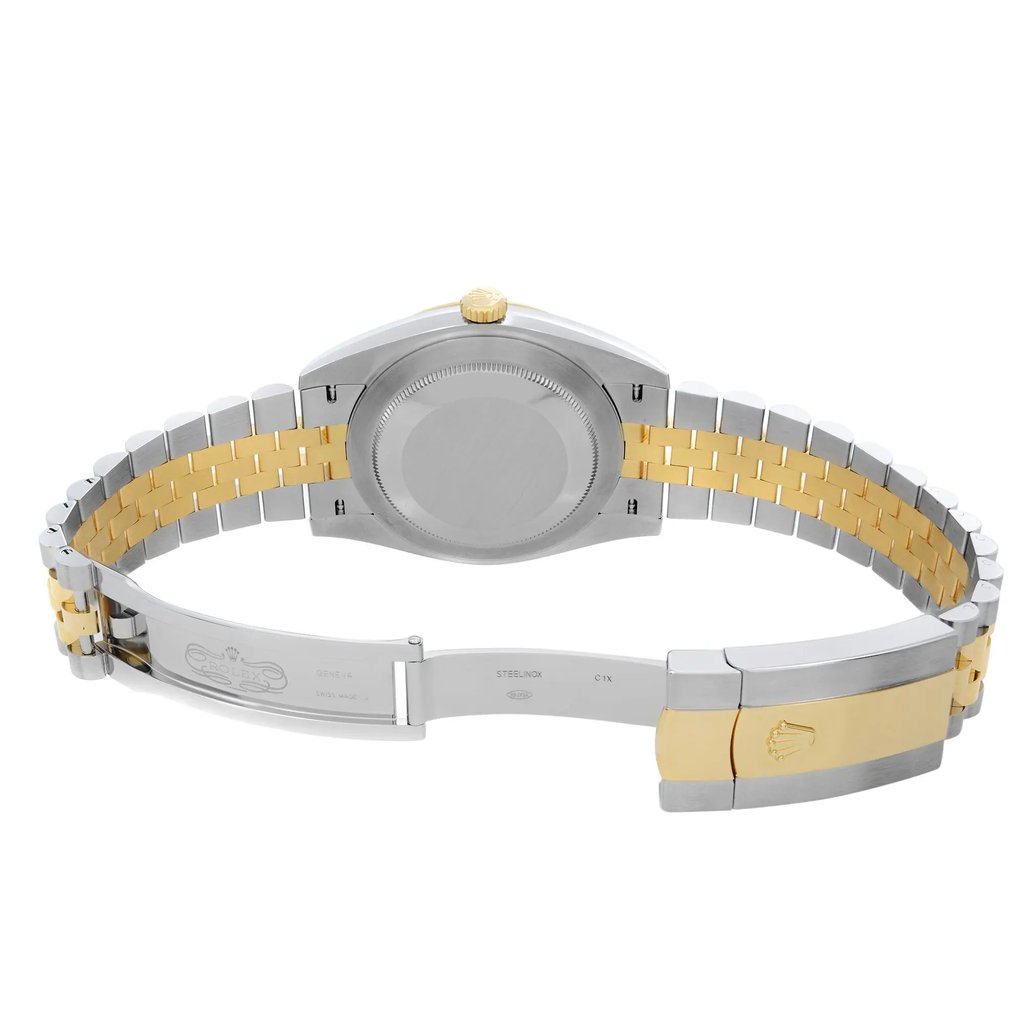 An image of a pre-owned men's Rolex wristwatch showing the back view with an open clasp. The round case and screwback are made of stainless steel, and the band is a combination of stainless steel and solid gold. The watch is positioned at a slight angle with the top facing towards the upper left corner of the image, and the clasp is in the foreground. Minor signs of wear or scratches are visible on the surfaces. The distance is close enough to show detail while capturing the entire back side of the watch.
