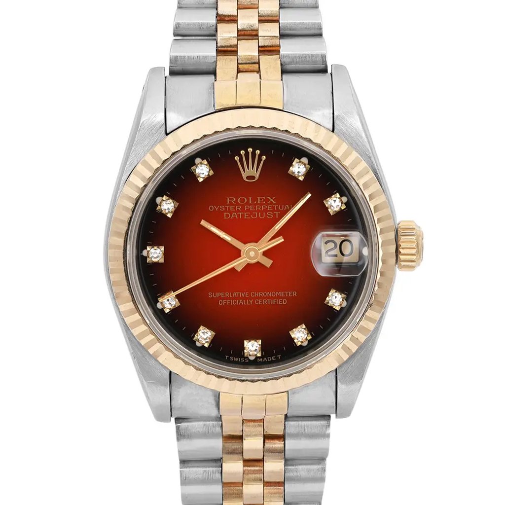 An image of a pre-owned wristwatch, captured in a front close-up shot highlighting the watch face. The watch features a two-tone design with a gold bezel and a silver and gold bracelet. The face displays a gradient red hue with diamond hour markers and a date window on the right side. The brand logo is positioned at the top center of the watch face.