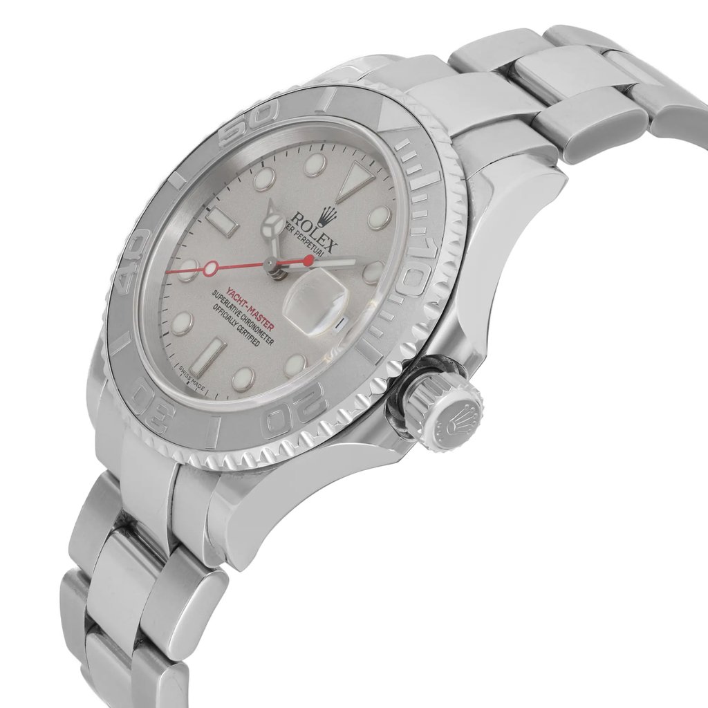An image of a pre-owned wristwatch shown from a side profile view, highlighting the crown. The angle captures the watch's silver bezel and bracelet in detail, with the dial partially visible. The shot is taken at a close distance, emphasizing the design and condition of the watch.