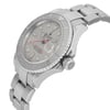 An image of a pre-owned wristwatch shown from a side profile view, highlighting the crown. The angle captures the watch's silver bezel and bracelet in detail, with the dial partially visible. The shot is taken at a close distance, emphasizing the design and condition of the watch.