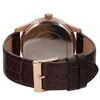 An image of a pre-owned men's GUESS wristwatch, captured from a rear angle. The focus is on the watch's back, highlighting the metallic case and engraved details. The watch is positioned upright, with the brown leather strap and gold-toned buckle prominently displayed in the foreground. The image is taken at a close distance, showcasing the texture and craftsmanship of the strap and case.