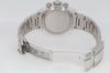 An image of a pre-owned men's Rolex wristwatch, viewed from the back at a slight angle, showcasing the closed clasp and bracelet links. The watch is positioned centrally, with the focus on the detailed engravings on the clasp. The angle highlights the chronograph buttons and the polished finish of the watch, emphasizing its craftsmanship and design features.