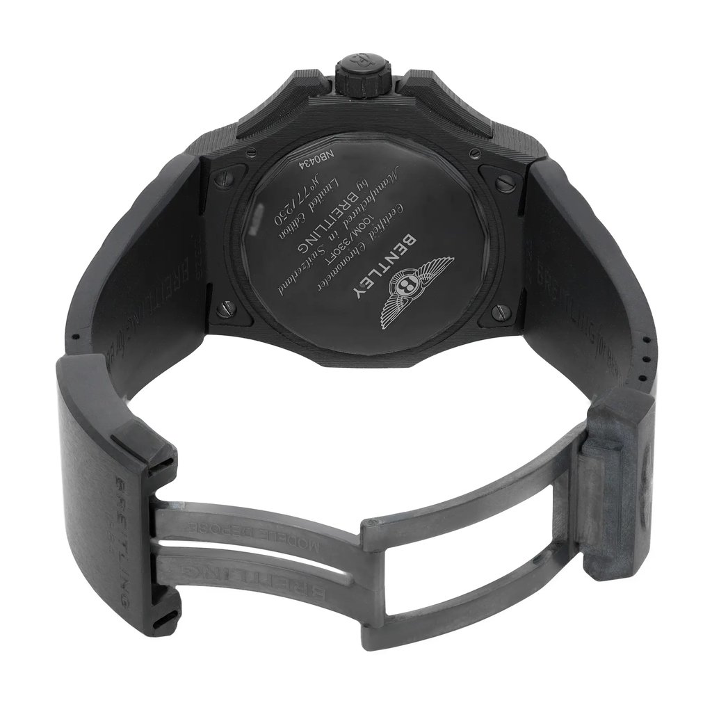 An image of a wristwatch viewed from the back, showcasing an open clasp. The watch is positioned upright with the back plate visible, displaying engraved details. The angle captures the full length of the band, highlighting the open clasp mechanism. The watch is a display model in pristine condition, photographed at a close distance to emphasize its features.