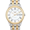 An image of a pre-owned Longines men's wristwatch in good condition, presented in a front close-up view that highlights the watch face. The watch features a round white dial with black Roman numeral indices, a 12-hour dial display, and a day-date function at 3 o'clock. The hands are gold-toned, matching the gold-tone bezel. The stainless steel band combines silver and gold tones, with micro scratches visible on the gold parts. The Longines logo is positioned below the 12 o'clock mark, and the word "AUTOMATIC" is inscribed above the 6 o'clock mark, indicating the watch's movement type.