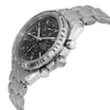 An image of a pre-owned wristwatch captured from a side profile view, showcasing the crown prominently. The watch features a silver metal bracelet and a black dial with three subdials. The bezel displays a tachymetric scale. The angle highlights the details of the crown and pushers on the right side of the case, offering a close-up perspective.