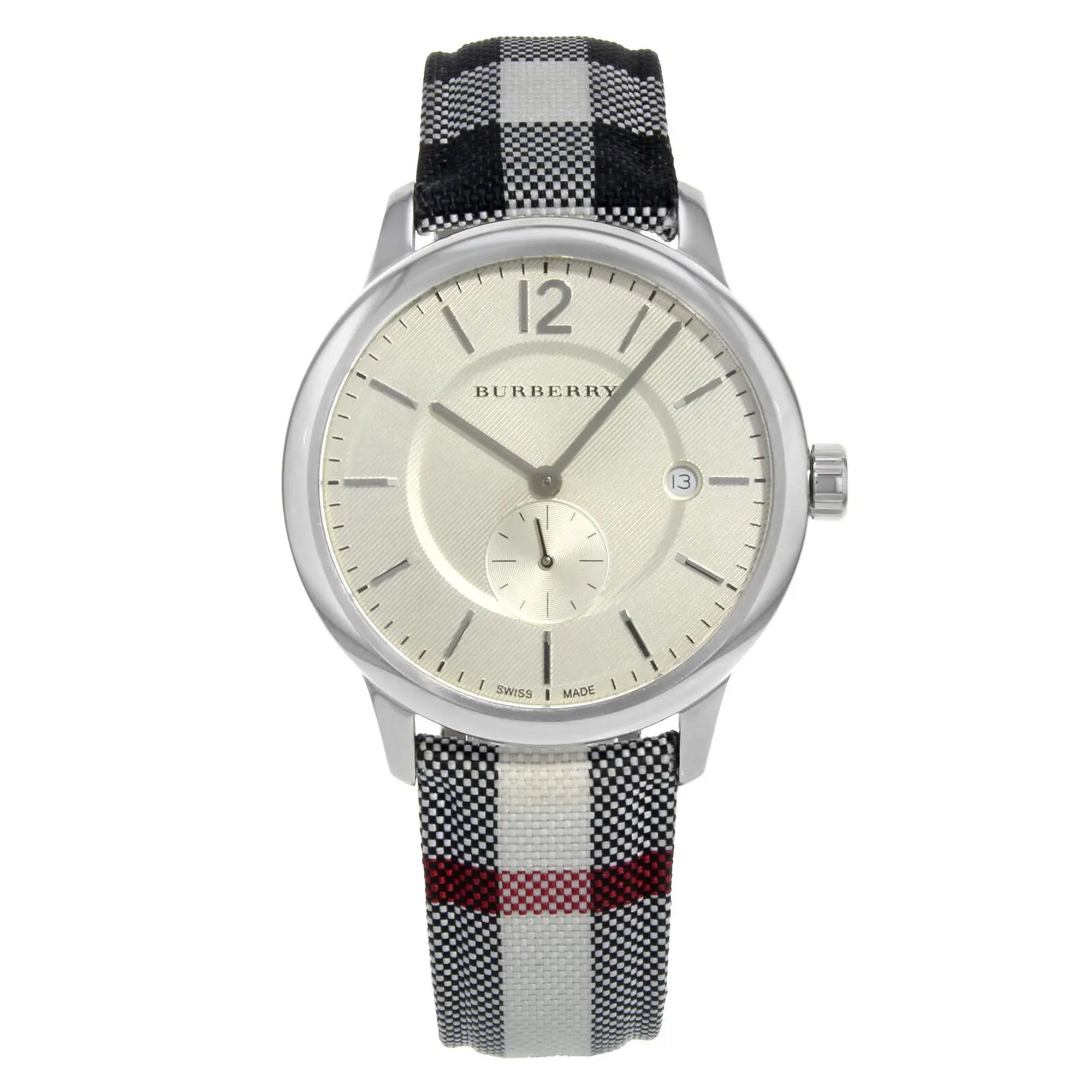 An image of a Wristwatch by Burberry. This Display Model item is designed for Unisex, featuring a Classic style. It has a Quartz movement and an Analog display with a Silver dial color. The indices include Sticks. The band is made of Fabric & Leather and the case is made of Stainless Steel. The watch has a Round shape with a case size of 40 mm and a case thickness of 8 mm.