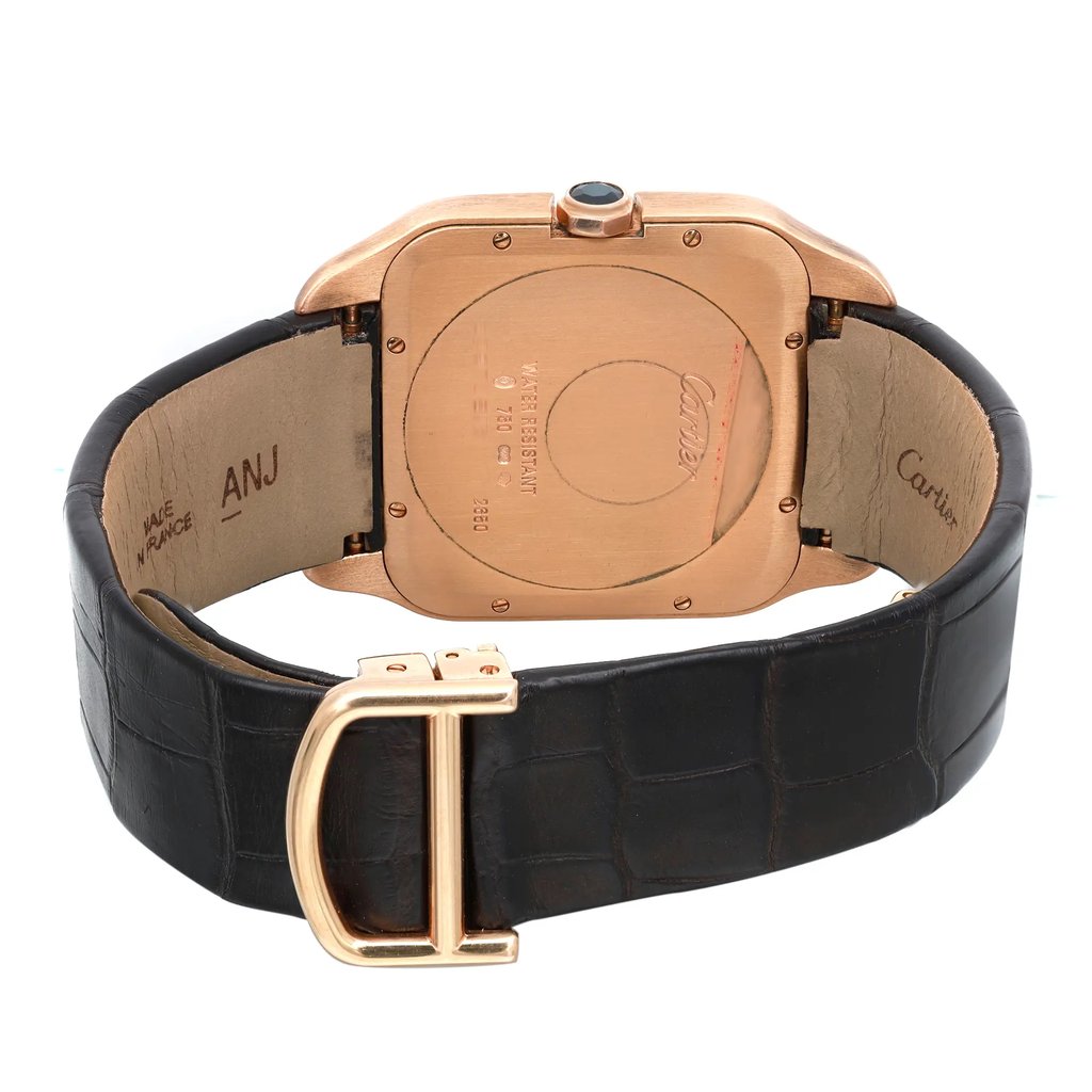 An image of a pre-owned wristwatch focused on the back view, showcasing the closed clasp. The watch features a square case in a metallic finish with visible engravings. The leather strap is dark and textured, with the clasp centrally positioned at the bottom of the image. The angle is straight-on and the watch is photographed from a close distance, highlighting the details on the back.