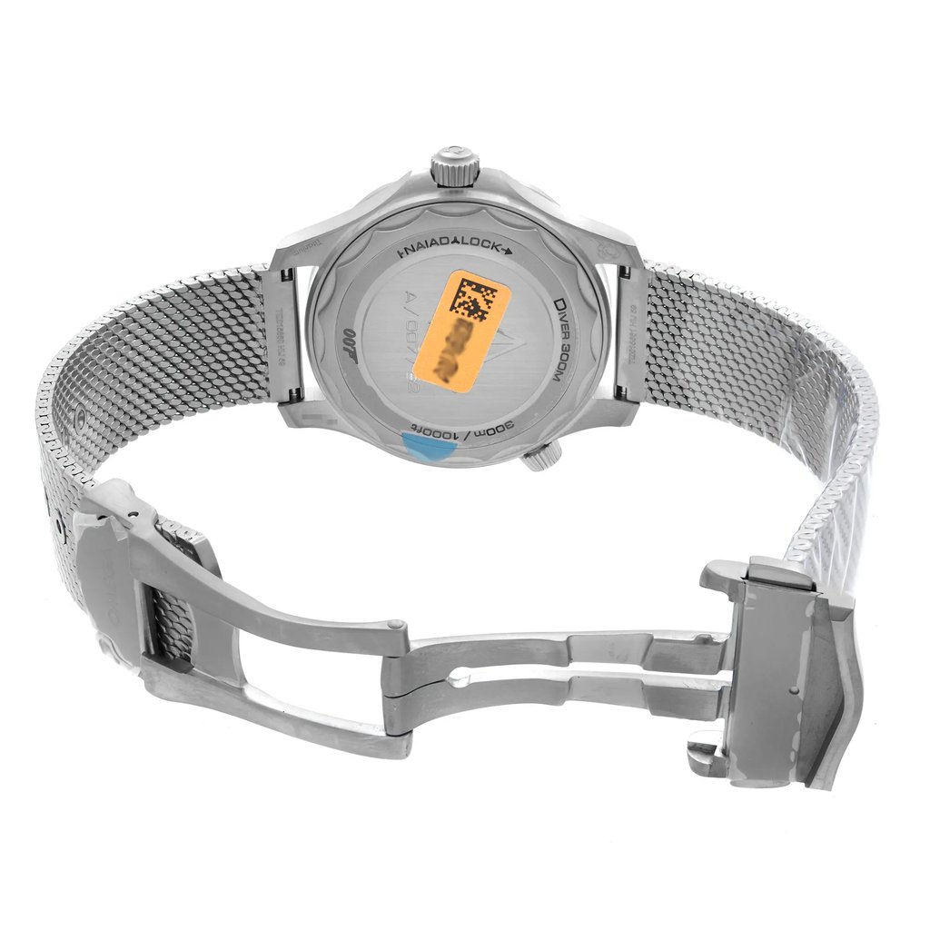 An image of a men's OMEGA wristwatch, display model, featuring a titanium case and band with a round watch shape. The back view showcases a solid caseback with branding details, and the clasp is open, revealing a fold-over closure with double push buttons. The wristwatch is positioned at a slight angle with the top of the watch facing slightly to the right and the open clasp extending to the left, all against a neutral background and photographed from a medium distance.