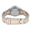 An image of a pre-owned wristwatch showcasing the back view with a closed clasp. The watch has a two-tone metal bracelet, featuring both silver and gold links. The focus is on the clasp and the back of the watch case, captured at a close distance and straight angle.