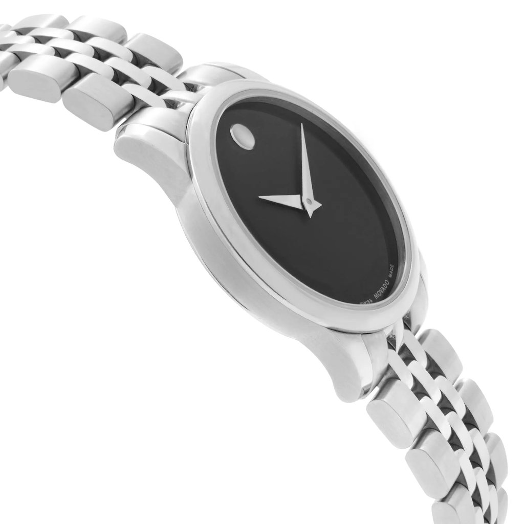An image of a wristwatch taken from a side profile view, opposite the crown. The watch is a display model, featuring a sleek design with a black dial and minimalist silver hands. The stainless steel bracelet is visible, showcasing its polished links. The angle captures the watch at a slight tilt, emphasizing the smooth contours of the case. The photo is taken at a close distance, highlighting the watch's elegant craftsmanship.