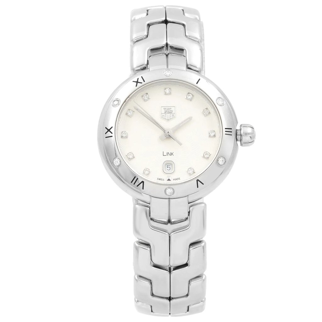 An image of a Wristwatch by TAG Heuer. This Pre Owned item is designed for Women, featuring a Dress/Formal style. It has a Quartz movement and an Analog display with a Silver dial color. The indices include Diamonds. The band is made of Stainless Steel and the case is made of Stainless Steel. The watch has a Round shape with a case size of 28 mm and a case thickness of 9 mm.