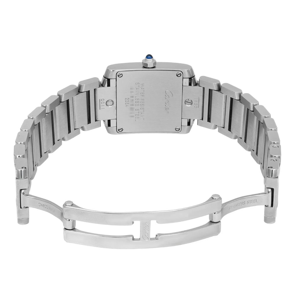 An image of a pre-owned wristwatch shown from the back view. The clasp is open, revealing the stainless steel bracelet and the rectangular watch case. The photograph is taken at eye level and at a moderate distance, clearly displaying the watch’s metal links and the inscriptions on the back of the case.