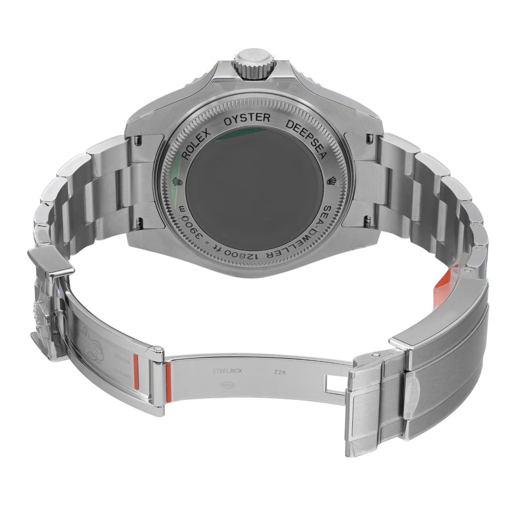 An image of a wristwatch viewed from the back, showcasing its open clasp. The watch is positioned centrally, with the angle focusing on the rear casing and the bracelet. The distance is close enough to highlight the details and engravings on the back, emphasizing the unworn condition of the watch.