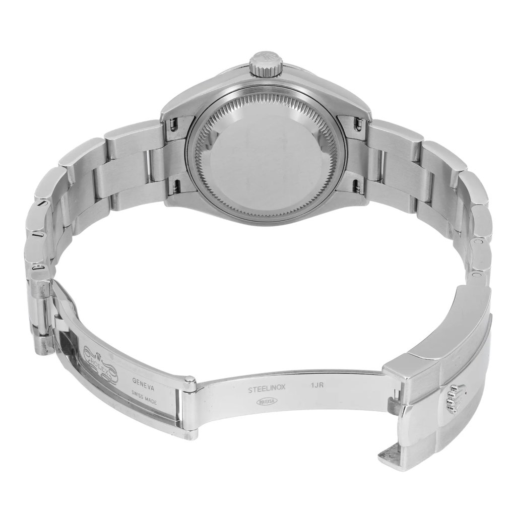 An image of a pre-owned wristwatch showcasing the back view with an open clasp. The watch is positioned at a slight angle to highlight the stainless steel bracelet and the closed case back. The image captures the watch from a moderate distance, allowing a clear view of the bracelet links and clasp engravings.
