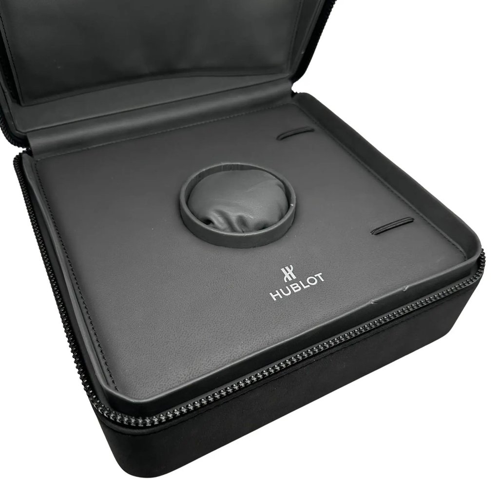 An image of a Wristwatch by Hublot. This Pre Owned item is designed for Men, featuring a Sport style. It has a Mechanical (Automatic) movement and an Analog display with a Blue dial color. The indices include 12-Hour Dial. The band is made of Rubber and the case is made of Stainless Steel. The watch has a Round shape with a case size of 44 mm and a case thickness of 15 mm.