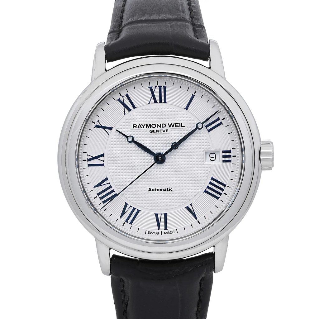 An image of a Raymond Weil men's wristwatch, captured from the front in a close-up shot. The watch features a round stainless steel case with a silver tapisserie-patterned dial. It has Roman numeral indices and a date indicator on the right side. The bezel is steel-colored, and the watch is paired with a black leather band. The condition is excellent, as it is a display model.