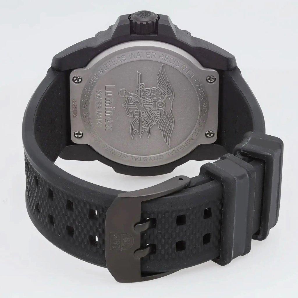 An image of a Wristwatch by Luminox. This Display Model item is designed for Men, featuring a Casual,Diver,Military style. It has a Quartz movement and an Analog display with a Black dial color. The indices include 12-Hour Dial,Arabic Numerals. The band is made of Rubber and the case is made of Carbon. The watch has a Round shape with a case size of 45 mm and a case thickness of 14 mm.