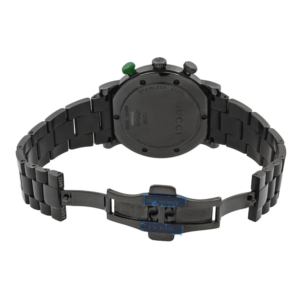 An image of a pre-owned Gucci men's wristwatch, shown from the back view with an open clasp. The watch features a round stainless steel case with a screwback design, connected to a stainless steel band. The fold-over clasp is equipped with a double push button and is partially visible, angled slightly away from the viewer. The watch is positioned centrally against a white background, allowing clear visibility of its structure and details.