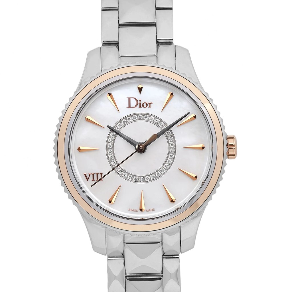 An image of a pre-owned wristwatch taken from the front at a close-up angle, focusing on the watch face. The watch features a silver and gold-toned bezel with a white dial, gold hour markers, and a decorative circle of small crystals. The brand name "Dior" is prominently displayed on the dial, and the watch has a metallic strap.