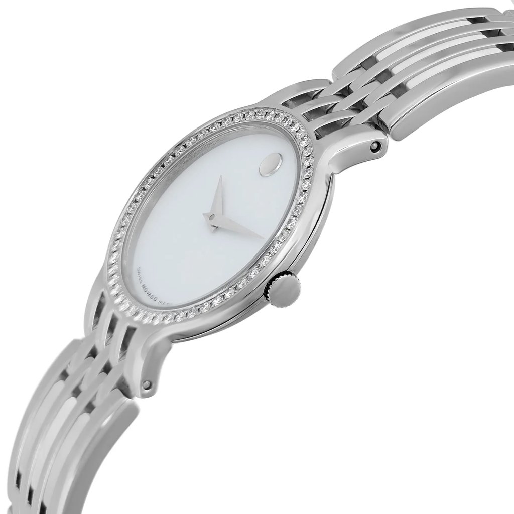 An image of a pre-owned women's Movado wristwatch taken from a side profile view, highlighting the crown. The watch has a round shape with a white dial and a gray bezel. The band is made of a combination of ceramic and stainless steel, and the case is stainless steel. The watch is styled casually and positioned at an angle to emphasize the sleek design.